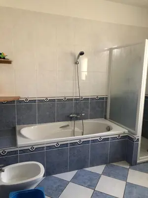 a bathroom with a tub and a toilet and a shower at Jolie studio en Provence! in Pierrevert
