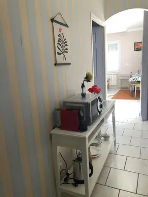 a kitchen with a table with a microwave on it at Jolie studio en Provence! in Pierrevert