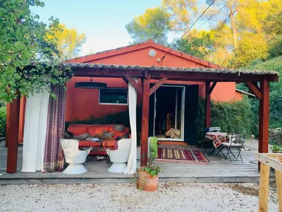 a gazebo with a couch and chairs on a deck at Le Mas St Pierre in Aix-en-Provence