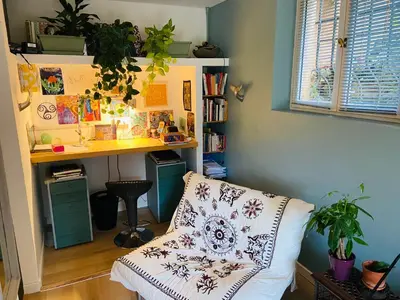 a room with a couch and a desk and a table at Le Mas St Pierre in Aix-en-Provence