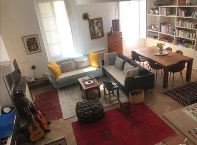 a living room with a couch and a table at 100m2 beautiful appartment in Aix City Center in Aix-en-Provence
