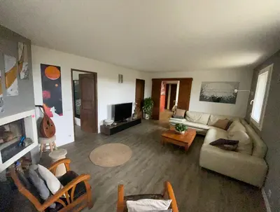 a living room with a couch and a tv at Zen house with a view in Manosque