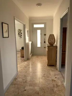an empty hallway with aoyer with a door and a table at La Maison de Gari spacious house with swimming pool and beautiful exterior in Les Taillades