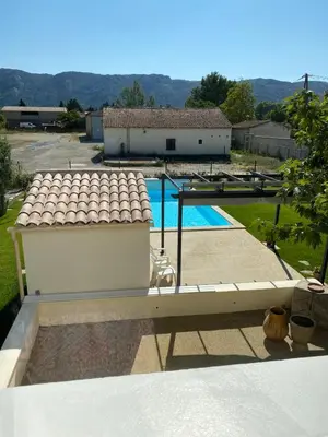 a view of a pool from the roof of a house at La Maison de Gari spacious house with swimming pool and beautiful exterior in Les Taillades
