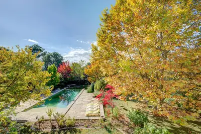 an aerial view of a garden with a swimming pool at MAS DES CIGALES Lambesc in Lambesc