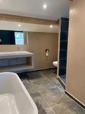 a bathroom with a tub and a sink and a toilet at Maison du soleil in Caumont-sur-Durance