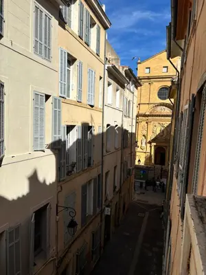 an alley in an old city with buildings at Studio lumineux centre Aix en Provence in Aix-en-Provence