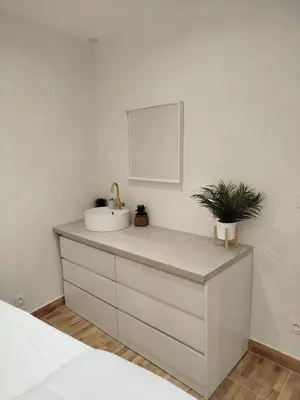 a bedroom with a white dresser with a mirror at Charmant Appartement en Provence in Caromb