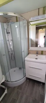 a bathroom with a shower and a sink at Chalets dans le Luberon in Viens