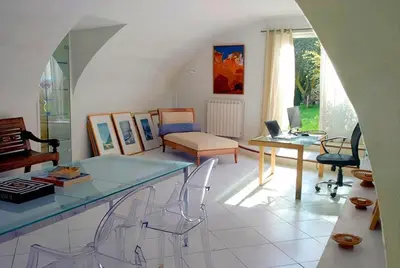 a living room with a glass table and chairs at Authentique mas provençal avec piscine in Beaumont-de-Pertuis