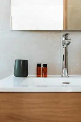 a sink with two bottles on a counter at La Source Blanche in Gargas