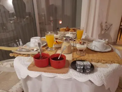 a table with a tray of breakfast food and orange juice at alize gîte en Provence in Jonquerettes