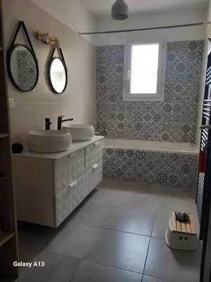 a bathroom with a sink and a mirror at villa zen en provence in Velleron