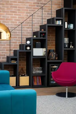 a living room with a blue couch and a red chair at Aix-en-Provence, Centre ville quartier Mazarin, magnifique loft in Aix-en-Provence
