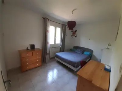 a bedroom with a bed and a dresser and a window at 4 bedroom villa pool entire place in Salon-de-Provence