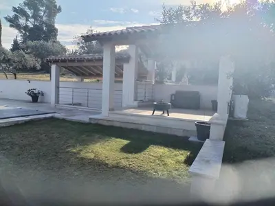 a gazebo with a grill in a yard at Close to Saint-Rémy-de-Provence in Eyragues