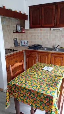 a kitchen with a table with a colorful table cloth at Aix en Provence in Aix-en-Provence