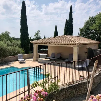 a villa with a pool and a gazebo at Sous le figuier in La Roque-sur-Pernes