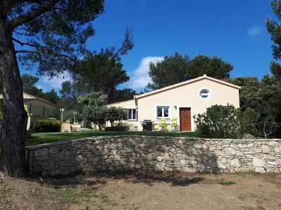 a white house with a stone wall at LS1-451 - Chambri in Orgon