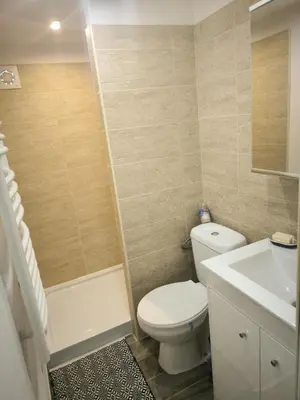 a bathroom with a white toilet and a sink at Logement 2 personnes in Morières-lès-Avignon