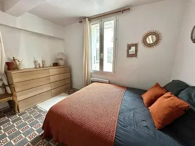 a bedroom with a bed and a window at Historic Centre Location Charming House with Style in Carpentras