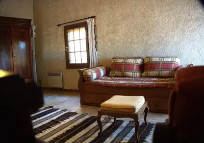 a living room with a couch and a window at Villa provençale 4 chambres à Aix en Provence in Aix-en-Provence