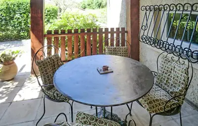 a table and chairs sitting on a patio at Amazing Home In Vedène in Vedène