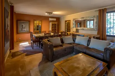 a living room with a couch and a table at Gite Lucie in Carpentras