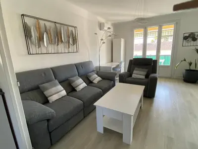 a bedroom with a bed and a stained glass window at Grand appartement spacieux in Sénas