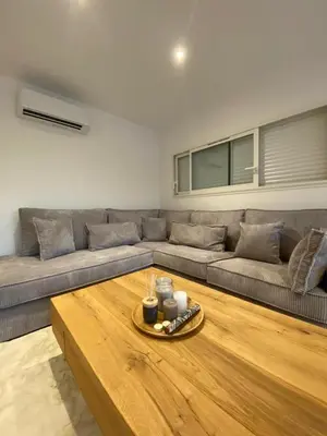a living room with a couch and a coffee table at La Maison Myssa in Apt