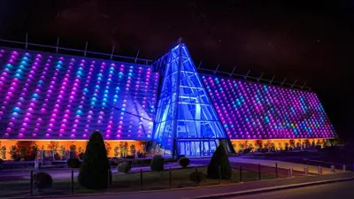 a building with purple and blue lights on it at Appartement calme et spacieux à Aix en Provence in Aix-en-Provence