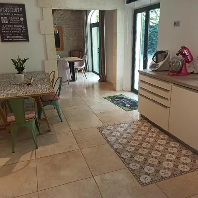 a kitchen and dining room with a table and chairs at Charming house Saint Remy de Provence in Saint-Rémy-de-Provence