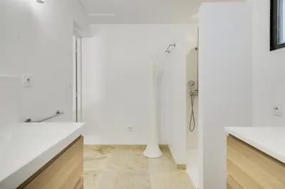 a white bathroom with a shower and a sink at Villa Cali - Air-conditioned, Pool, Heart Village in Cabrières-dʼAvignon