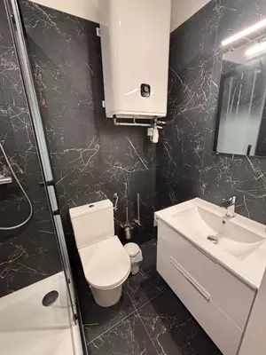 a bathroom with a toilet and a sink at Charmant appartement aixois in Aix-en-Provence