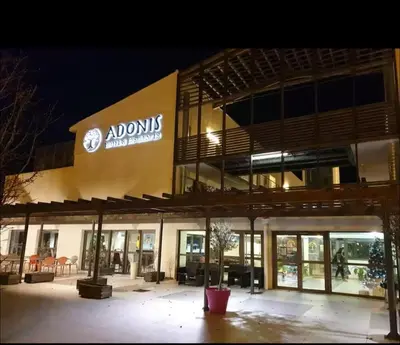 a building with a sign on the side of it at Studio cosy, résidence de tourisme avec piscine in Aix-en-Provence