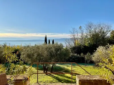 a goal in a garden with trees and bushes at Provence km28 in Gordes