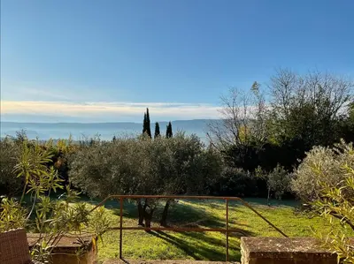 a view of a garden with trees and a goal at Provence km28 in Gordes