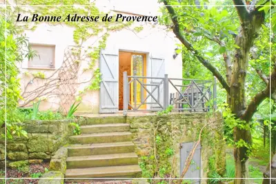 a staircase leading up to a house with a door at La Bonne Adresse - Gite ZENITUDE in Cornillon-Confoux