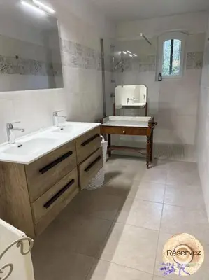 a bathroom with a sink and a tub and a bath tub at Villa Provençale avec piscine in Pernes-les-Fontaines