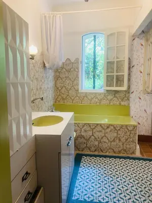 a bathroom with a sink and a window at Maison de famille en Provence in Rognes