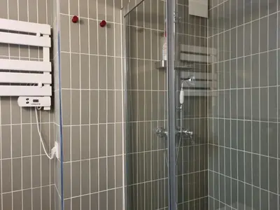 a shower with a glass door in a bathroom at MAYU MAYU - cocon centre-ville climatisation in Aix-en-Provence