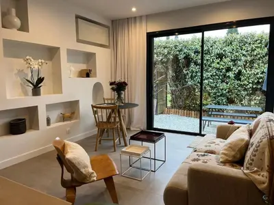 a living room with a couch and a table at La Réserve Villa in Aix-en-Provence