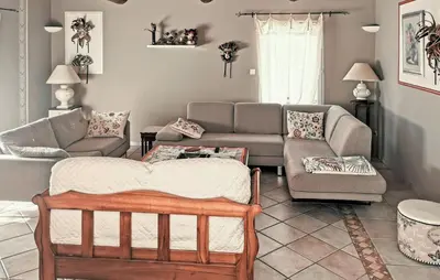 a living room with a couch and a table at Nice Home In Carpentras in Carpentras