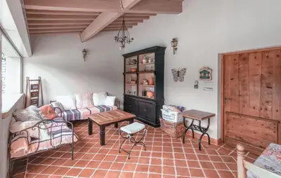 a living room with a couch and a table at Nice Home In Carpentras in Carpentras