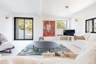 a living room with a couch and a table at Evasion Luberon in Murs