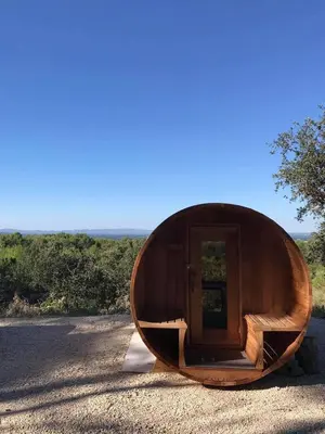 a wooden boat sitting on the side of a road at Gîte 33 ha Piscine Activités Vue in Saumane-de-Vaucluse