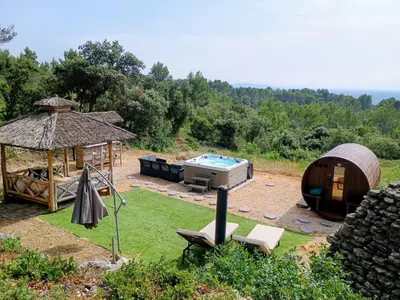 a backyard with a hot tub and a gazebo at Gîte 33 ha Piscine Activités Vue in Saumane-de-Vaucluse