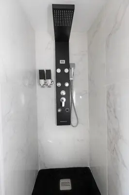 a bathroom with a blow dryer on the wall at Universo private pool and large garden in Pernes-les-Fontaines