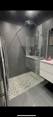 a shower with a glass door in a bathroom at Évasion Provençale in Aix-en-Provence