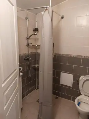 a bathroom with a shower with a toilet and a sink at Studio à louer sur Miramas in Miramas